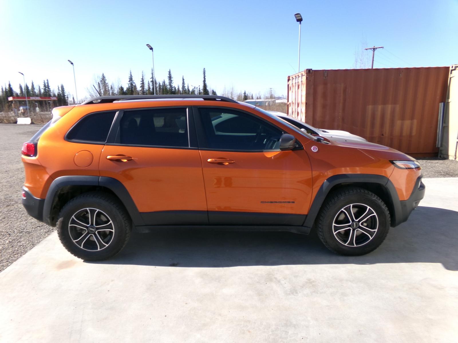 2015 orange Jeep Cherokee Trailhawk (1C4PJMBS1FW) with an 3.2L V6 DOHC 24V engine, 9-Speed Automatic transmission, located at 2630 Philips Field Rd., Fairbanks, AK, 99709, (907) 458-0593, 64.848068, -147.780609 - Photo #2